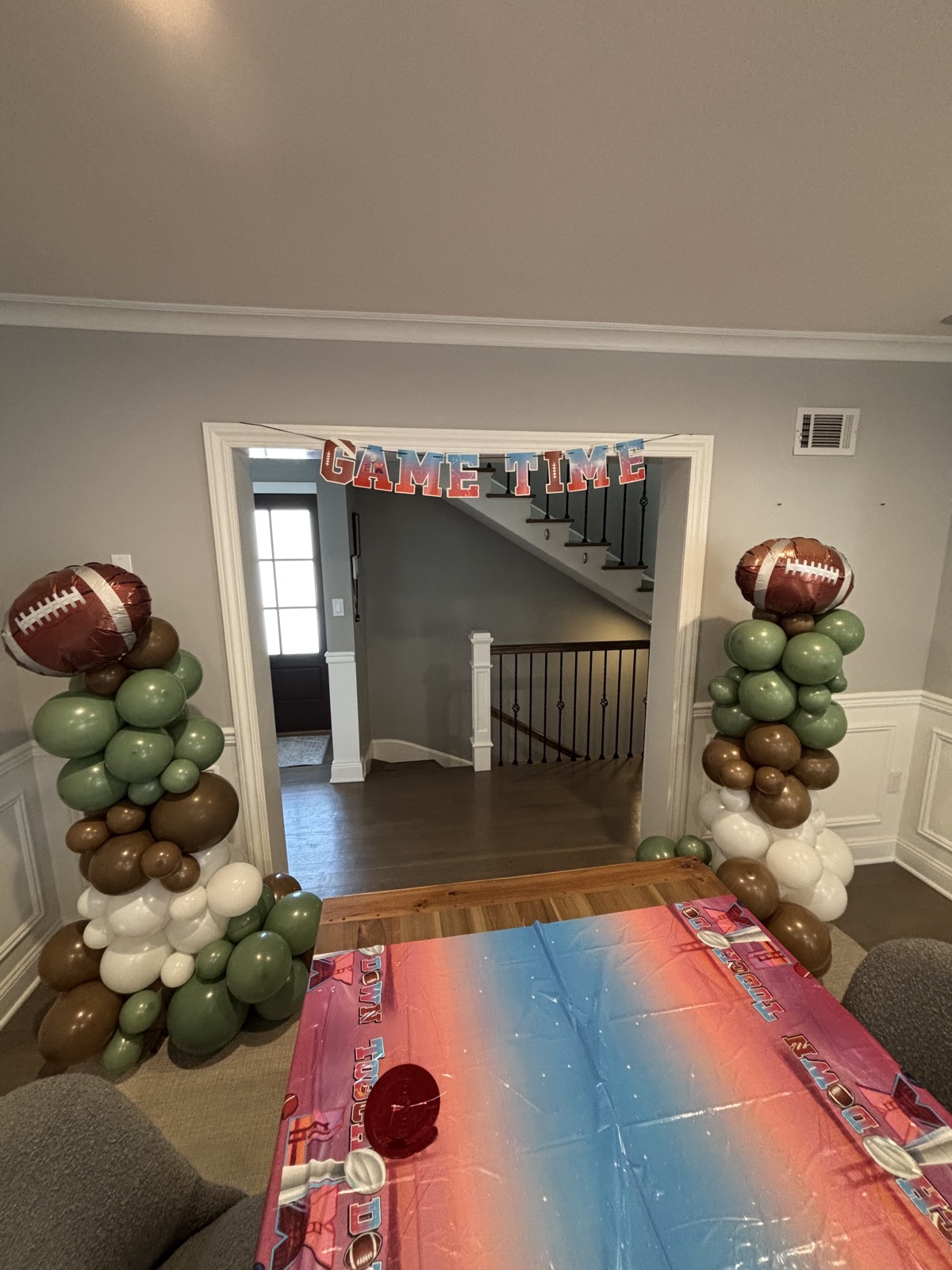 Game-day sage & brown columns — Themed install by Arches & Aesthetics by Lisa